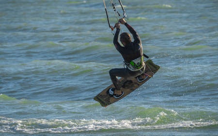 Marina di San Nicola, Italy - October 08, 2020, Lone kiter in sunny weather on the beach of Marina...