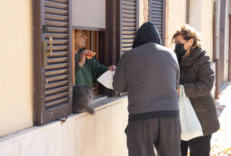 Orvinio, Italy - October 31, 2020, Masked and unmasked people in Italian Borgo Orvinio during second wave of coronavirus (Covid19), Italyのeditorial素材
