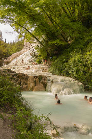 Rome, Italy - March 28, 2021, People taking thermal baths in free outdoor thermal pools in Bagni di San Filippo, Tuscany in Italyのeditorial素材