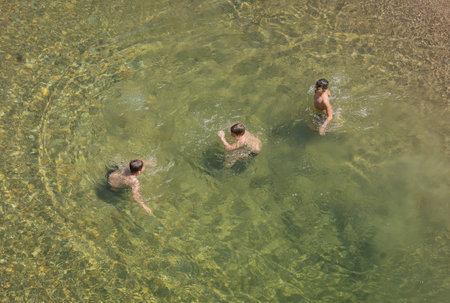 Bagni di Petriolo, Italy - May 09, 2021, People bathing in pools of thermal spring Bagni di Petriolo in Siena, Tuscany, Italyのeditorial素材