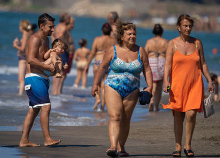 Marina di San Nikola, Italy - September 05, 2021, Crowd of people on the beach of Marina San Nicola who do not observe social distance during the coronavirus epidemic in Italyのeditorial素材