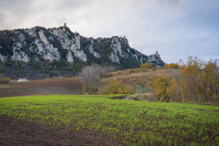 Scenic view of Mount Titano with all three towers of San Marino across fields
