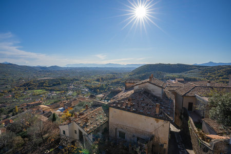 View of rooftops of Alatri from Acropolis and rays of sun, Fronzinone in Italyの写真素材