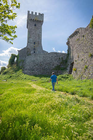 Ruins of medieval castle in Radicofani in Tuscany in Italyの写真素材