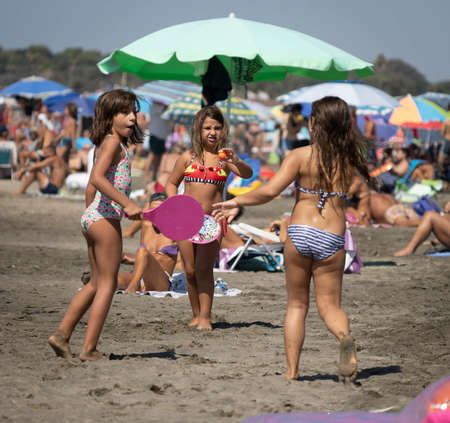 Marina di San Nikola, Italy - September 05, 2021, Family playing ball on the beach in Marina San Nicola in Italyのeditorial素材