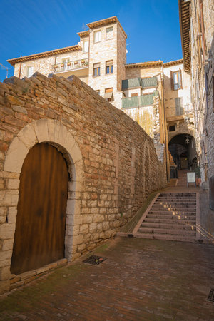 Assisi, Italy - November 20, 2021, Picturesque cityscape in the pink stone city of Assisi in Perugia, Italyのeditorial素材