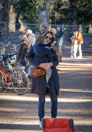 Rome, Italy - December 19, 2021, Mother and child on a walk in the Pincho Gardens in Rome, Italyのeditorial素材