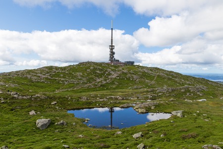 Mount Ulriken in Norway. Aerial view on the mountain lake and town by the fjords.の写真素材