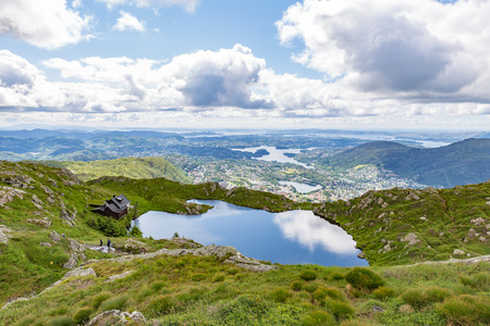 Mount Ulriken in Norway. Aerial view on the mountain lake and town by the fjords.の写真素材