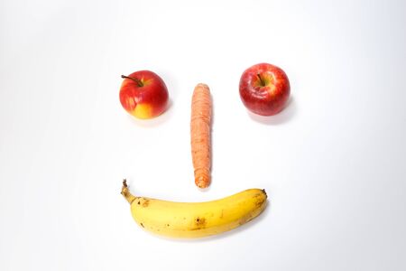 Happy smiling fruit face isolated on white backgroundの写真素材