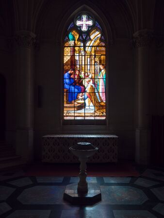 Dreux, France, April 30, 2019: artistic glass windows with baptismal font inside of the Chapel Royal Saint Louisのeditorial素材
