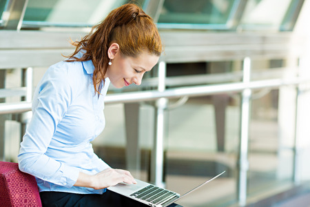 Business, technology, internet hotel concept  Closeup portrait happy smiling businesswoman, tablet pc computer, working checking email isolated の写真素材