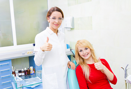 Closeup portrait happy female health care professional dentistの写真素材