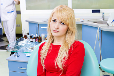Closeup portrait sad, woman with painful toothの写真素材