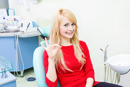 Closeup portrait young woman smiling happy patientの写真素材