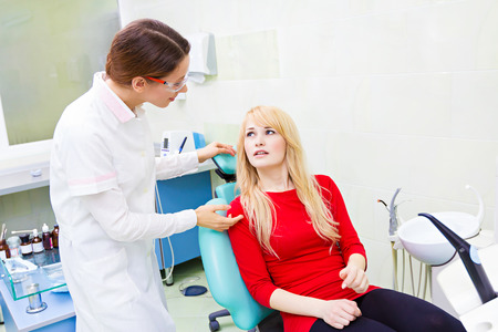 Closeup portrait sad patient woman with painful toothの写真素材
