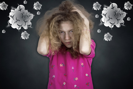 Closeup portrait angry, sad upset, grumpy, stressed little young girlの写真素材