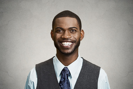 Closeup portrait, headshot, handsome happy, young, smiling business man, confident student, real estate agent, isolated black grey background. Positive face expressions, emotions, feelings, attitudeの写真素材