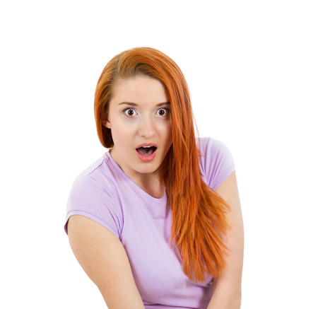 Closeup portrait happy cute young beautiful woman looking excited surprised in full disbelief, wide open mouth itの写真素材