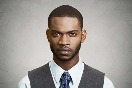 Closeup portrait, headshot handsome serious corporate business man looking at you gesture skeptically, isolated black background. Negative human emotions, facial expression, feeling, body languageの写真素材