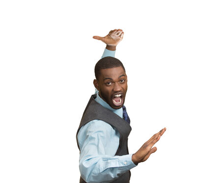 Closeup portrait angry mad furious, company man raising hands in air attack with karate chop isolated white background. Negative human emotion facial expression feeling, body language, signs, symbolsの写真素材