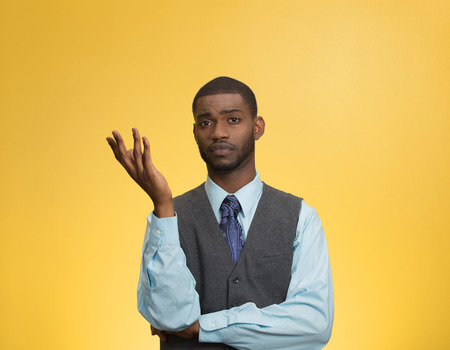 Closeup portrait dumb clueless young executive man, arm out asking why what problem so who cares, I...