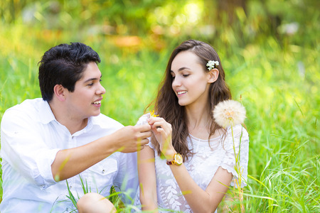 Horizontal Portrait happy, smiling young couple, man and woman, relaxing, enjoying summer sunny day in park. Positive human face expressions, emotions, feelings, life perception. Relationship conceptの写真素材