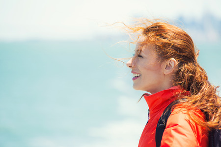 Side view closeup portrait, headshot beautiful young Woman relaxing on boat enjoying summer freedom...