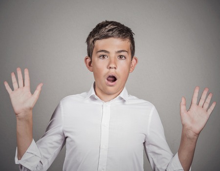 Closeup portrait handsome man shocked surprised in disbelief hands raised, wide open mouth eyes,...