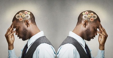 Closeup side view profile headshot two thoughtful men, back to back thinking hard, gear mechanism, illustration over head isolated grey wall background. Human face expression, emotions, body languageの写真素材