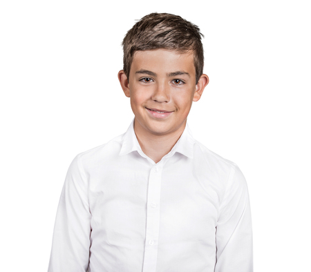Closeup portrait confident handsome teenager, young man in white shirt smiling, happy, arms folded isolated white background. Positive human face expression, emotion body language life perceptionの写真素材