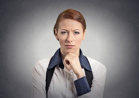 Skeptic doubtful woman looking at you camera isolated grey wall background.の写真素材