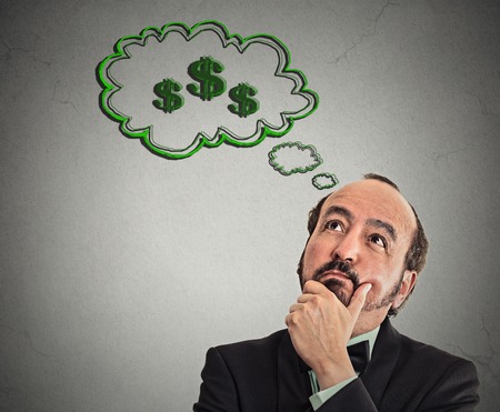 headshot man dreaming financial success money isolated grey wall backgroundの写真素材