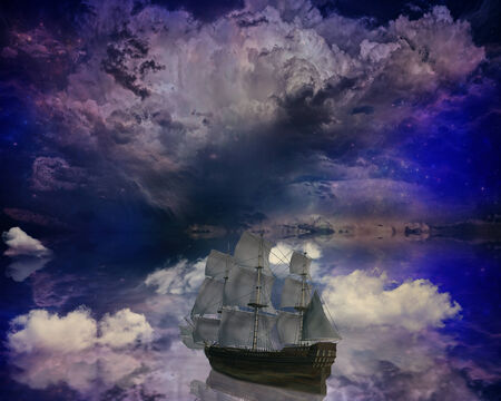 Vintage retro classic old sailboat on a dreamland surrealistic star skyline sky moon light background boat refection in water. の写真素材