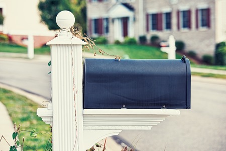 Mail Box on a house background