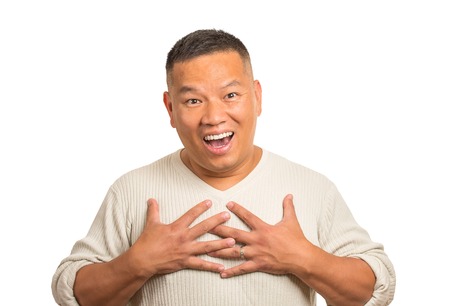 Closeup portrait headshot happy middle aged handsome man looking shocked surprised in disbelief hands on chest open mouth eyes isolated white background. Positive human emotion face expression feelingの写真素材