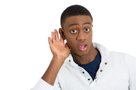 Headshot curious young man listening to conversation news eavesdropping hand to ear gesture privacy...