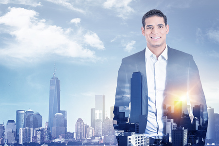 Double exposure of happy confident handsome business man in suit isolated on high city sky line with sunrise background. Corporate employee life style achievement conceptの写真素材
