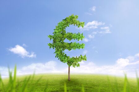 Financial growth and success on green summer natural green grass landscape with single trees in the shape of euro money sign showing business concept of growing prosperity and investments returnの写真素材
