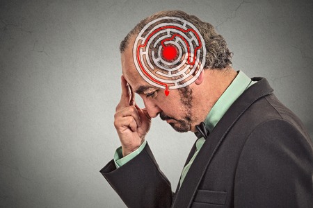 Right decision wisdom strategy concept. Side profile middle aged man solving problem isolated on gray wall background. Face expressionの写真素材