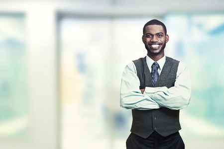 Portrait of a young smiling businessman. Positive face expression