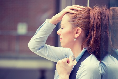 portrait stressed sad young woman outdoors. City urban life style stressの写真素材