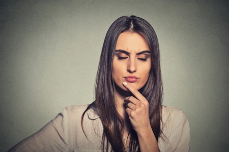 Thoughtful young woman thinking