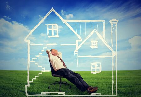 A safe house. Happy senior man enjoying his day in a new homeの写真素材