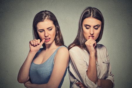 Two angry beautiful girls going through a conflict in their relationship lifeの写真素材