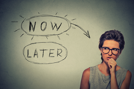 Now or later conceptの写真素材