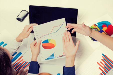 Business people investment consultant analyzing company annual financial report balance sheet...