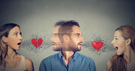 New relationship concept. Love triangle. Young man falls in love with another womanの写真素材