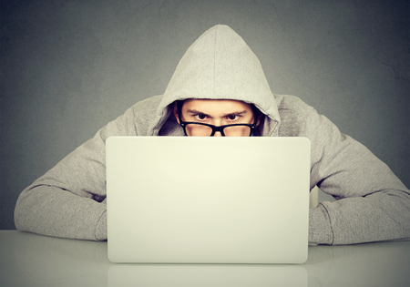 Young man using a laptopの写真素材