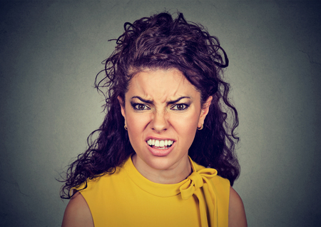 Closeup of an angry furious woman の写真素材